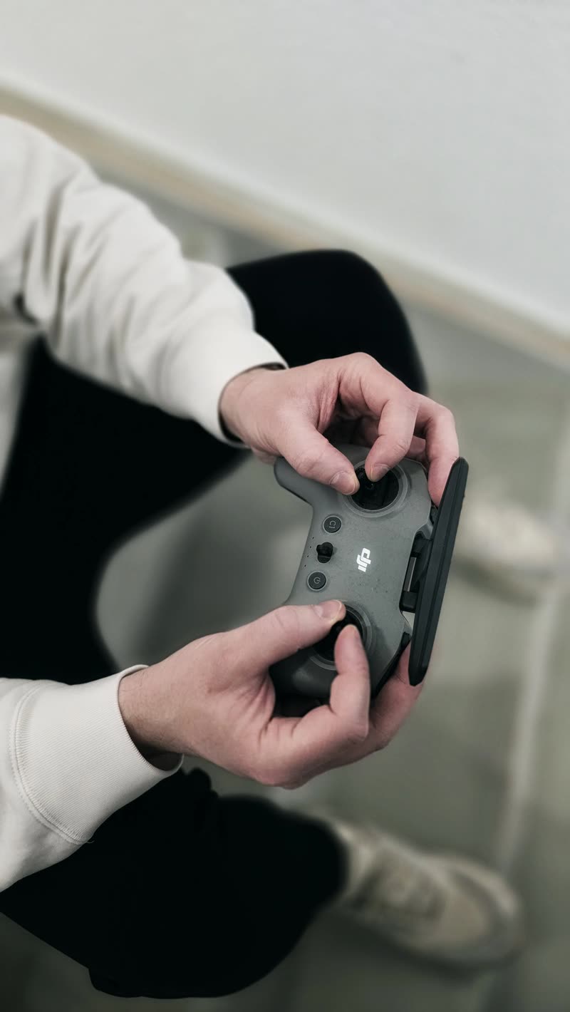 Drone controller in hand